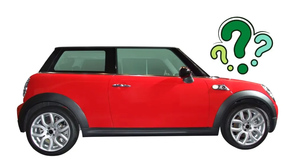 A shiny red two-door Mini Cooper with black trim, shown from the side, with three green question marks floating next to it.